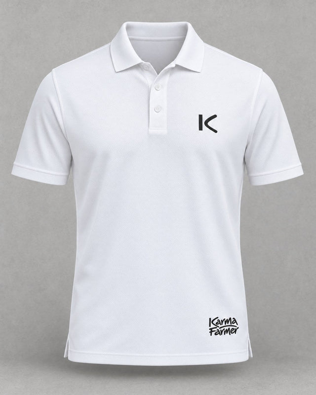 The white Court Polo from the front, with a small black K over the heart and a small Karma Farmer signature near the hem.