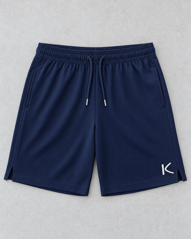 Navy Court Shorts laid flat, with a small chalk-white K on the leg.