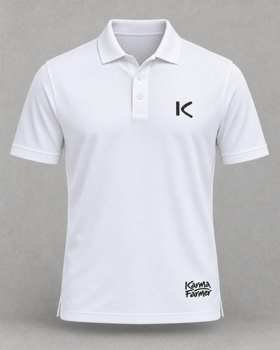 The white Court Polo from the front, with a small black K over the heart and a small Karma Farmer signature near the hem.