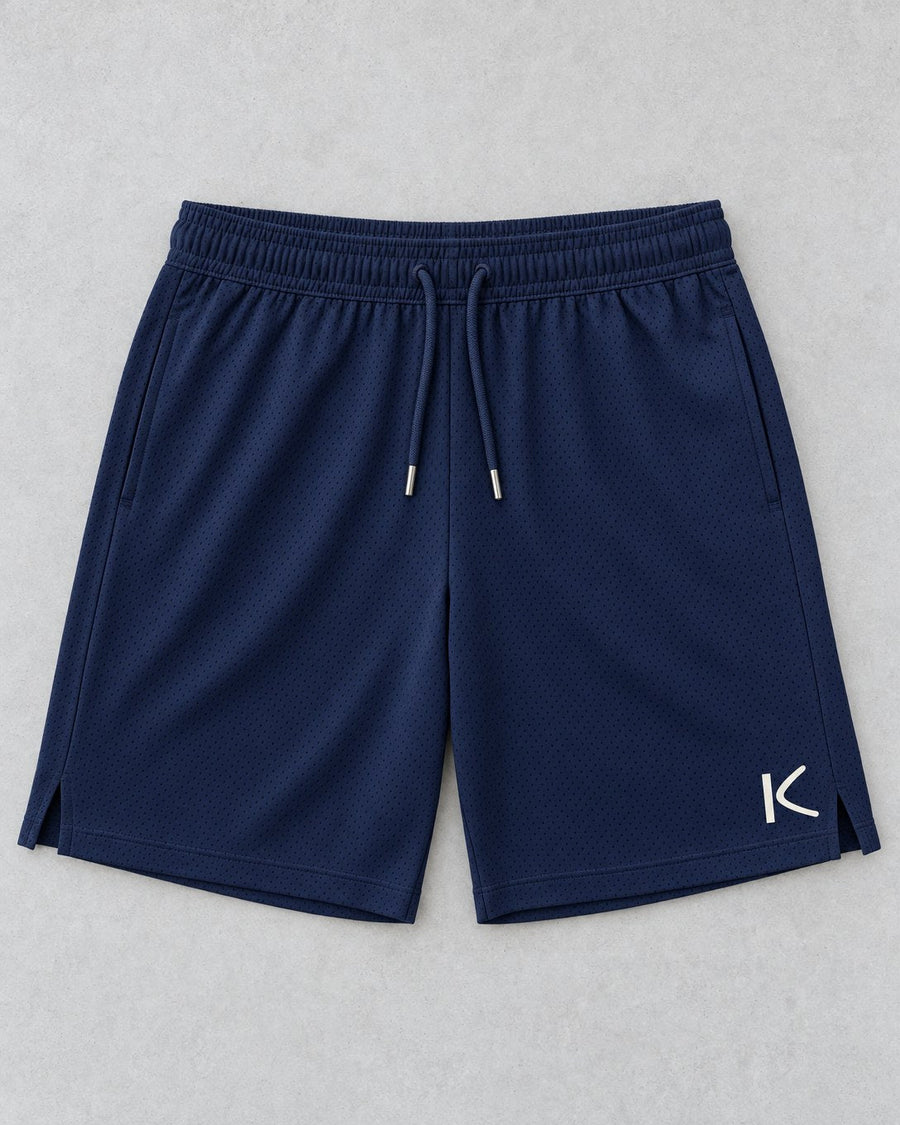 Navy Court Shorts laid flat, with a small chalk-white K on the leg.